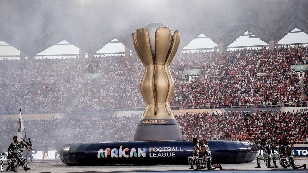 African football trophy in a packed stadium for AFCON 2027 travel advice